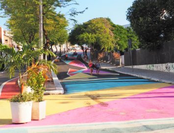 Women walking along colorful street in Fortaleza