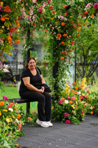 Woman sits in bus shelter by local artists who teamed up with the Arlington BRT project to create beautiful and unique art installations