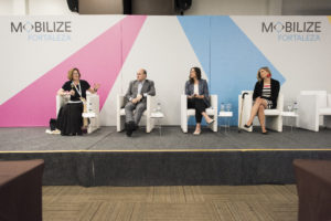 Diane Davis, Roberto Claudio, Lisa Bender, and Angela Anzola de Toro on stage during MOBILIZE opening plenary