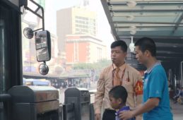 boy and father riding the Guangzhou BRT bus