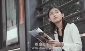 Woman waiting for the Guangzhou, GZ, BRT bus.